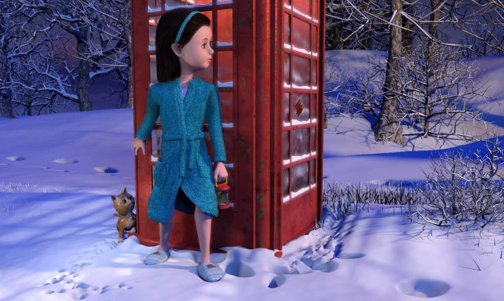 Girl and kitten in the snow hiding by a British red telephone box